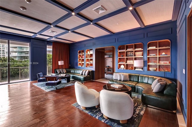 living room featuring wood-type flooring and coffered ceiling