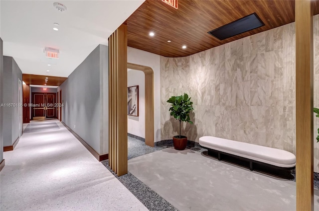 hall featuring wooden ceiling