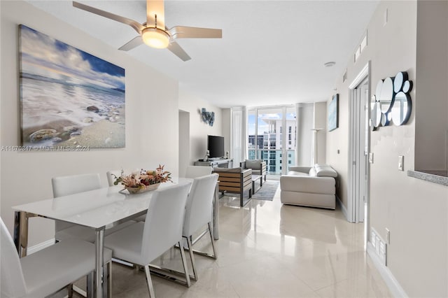 dining room with ceiling fan and floor to ceiling windows