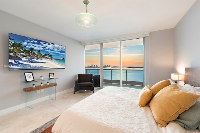 bedroom featuring light tile patterned flooring and access to exterior