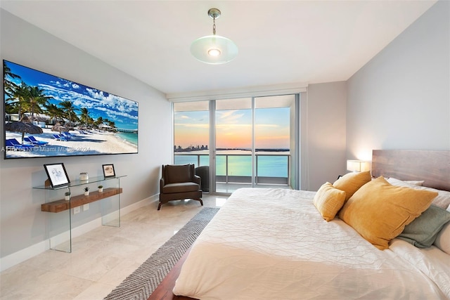 tiled bedroom featuring expansive windows