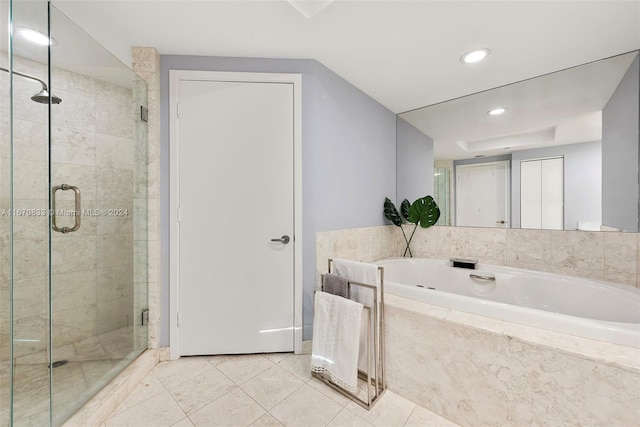 bathroom featuring plus walk in shower and tile patterned flooring