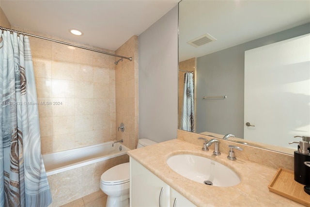 full bathroom featuring shower / bath combo, vanity, toilet, and tile patterned floors