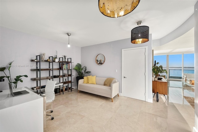 office area featuring a water view and floor to ceiling windows