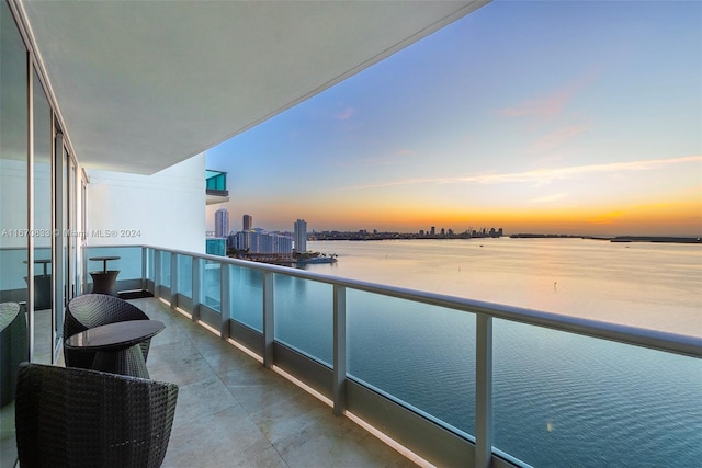 balcony at dusk with a water view