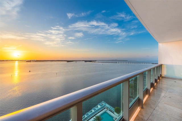 balcony at dusk with a water view