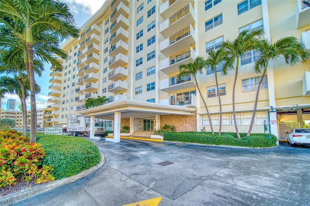 view of property with uncovered parking