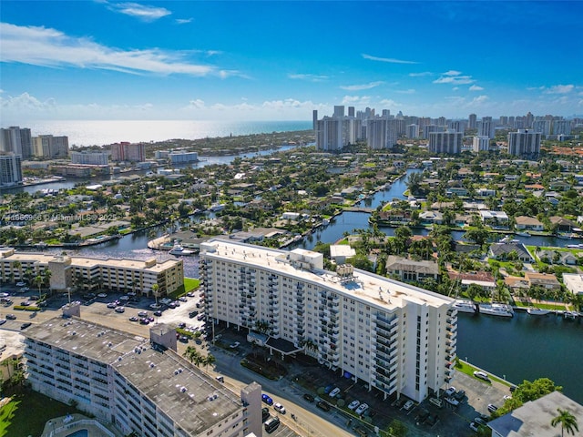 bird's eye view featuring a water view and a city view