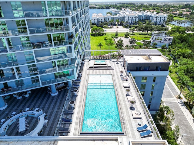 view of swimming pool featuring a water view