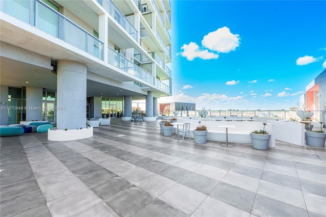 view of patio featuring a balcony