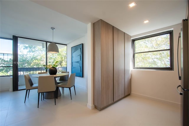 150 Sunrise Dr Unit 4B, Key Biscayne, FL 33149 - dining area with plenty of natural light and baseboards