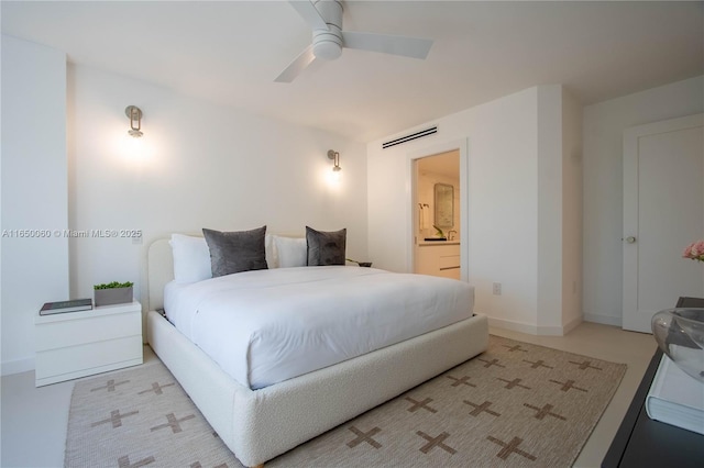 bedroom with ceiling fan and connected bathroom