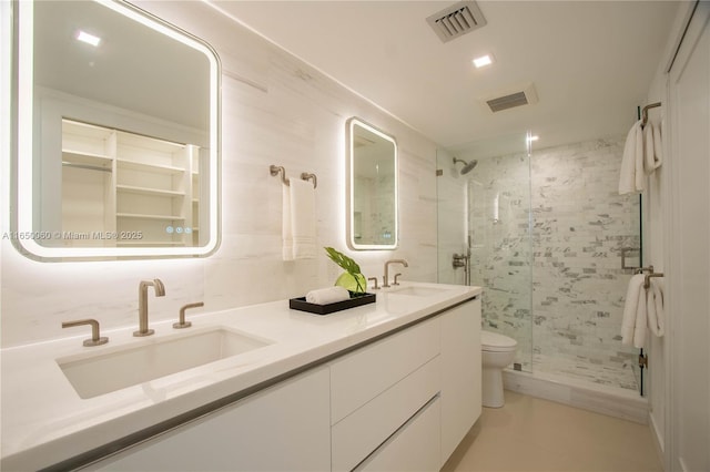 150 Sunrise Dr Unit 4B, Key Biscayne, FL 33149 - full bath with a shower stall, double vanity, toilet, and tile patterned floors