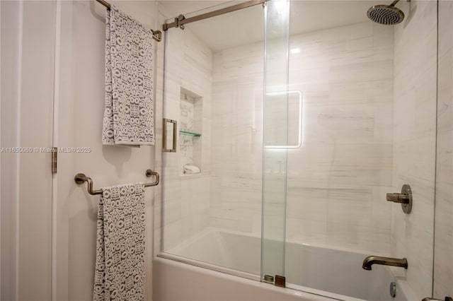 bathroom with shower / bath combination with glass door