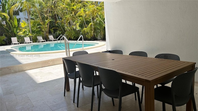 150 Sunrise Dr Unit 4B, Key Biscayne, FL 33149 - view of pool featuring a patio area and outdoor dining area