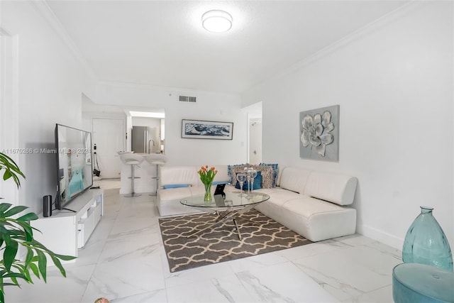 living room featuring crown molding