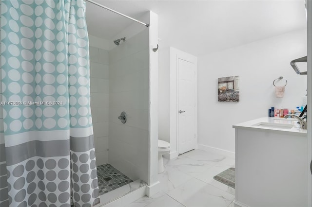 bathroom featuring walk in shower, vanity, and toilet