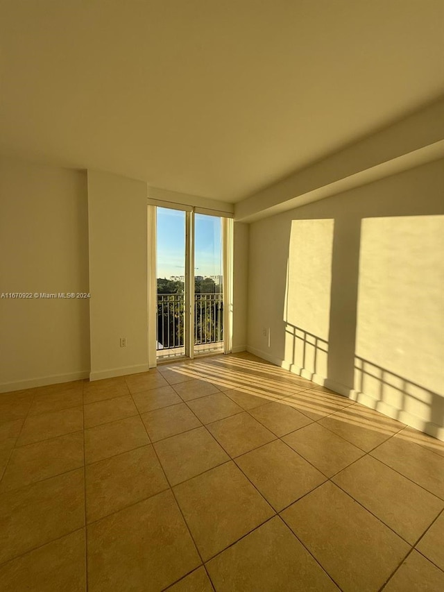 spare room with light tile patterned flooring