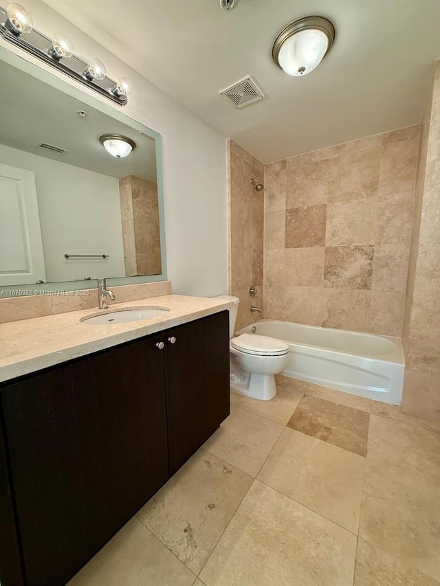 bathroom with toilet, vanity, visible vents, and shower / bathtub combination