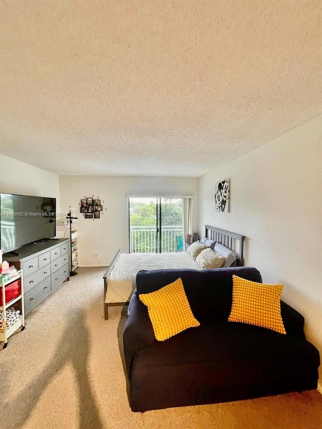 carpeted bedroom with a textured ceiling