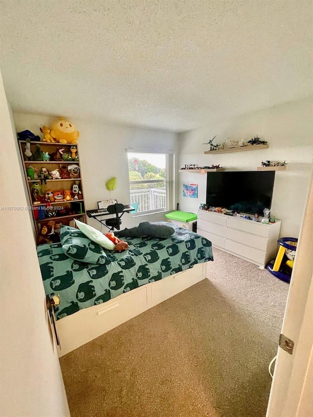 carpeted bedroom with a textured ceiling