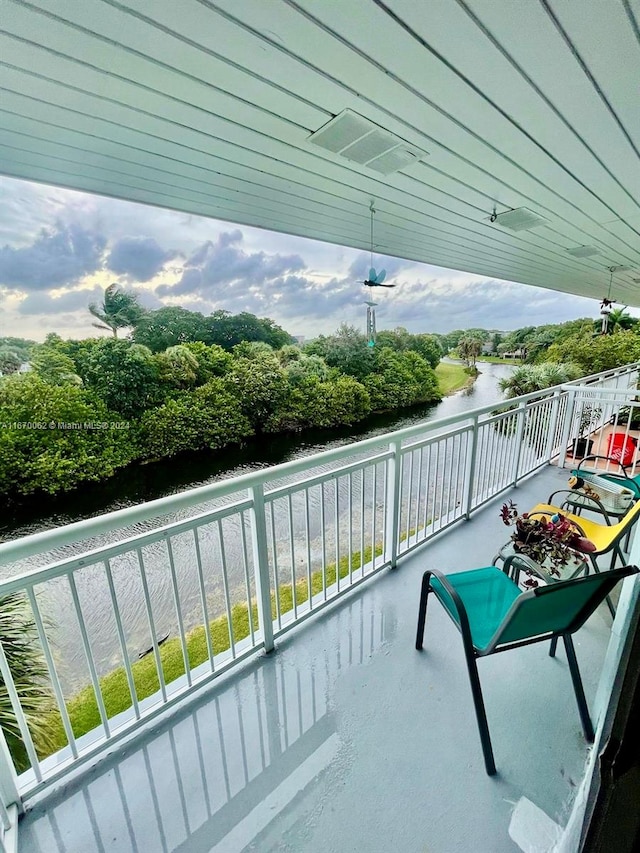 balcony featuring a water view