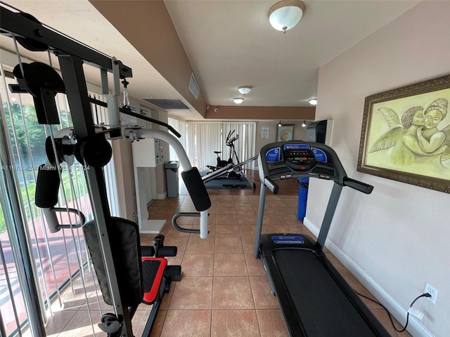 workout area with light tile patterned floors