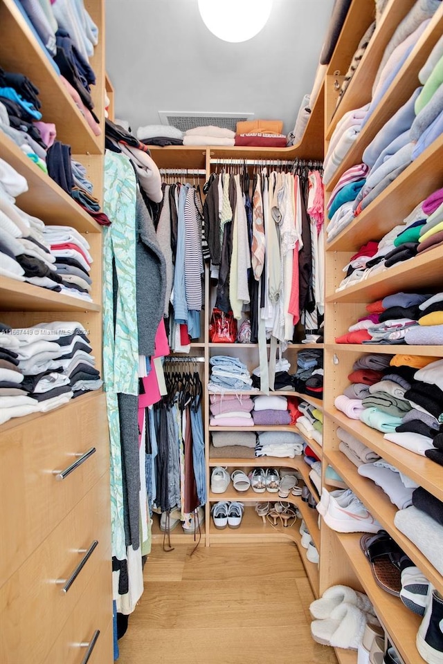 walk in closet featuring light wood-type flooring