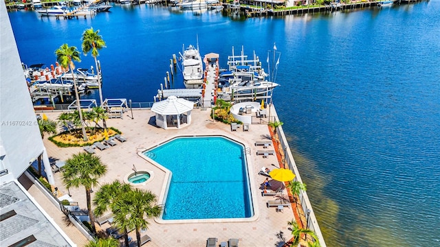 birds eye view of property with a water view