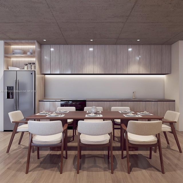 dining area with light hardwood / wood-style floors