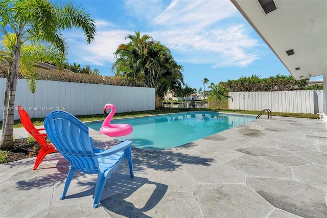 view of swimming pool with a fenced backyard, a fenced in pool, and a patio