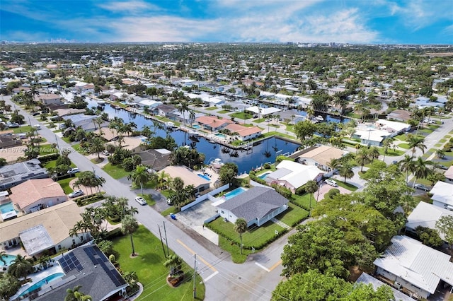 bird's eye view with a water view and a residential view