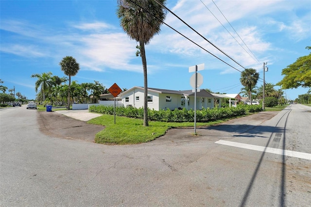 view of road with traffic signs and sidewalks