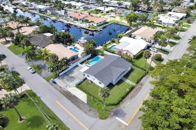 bird's eye view featuring a water view and a residential view