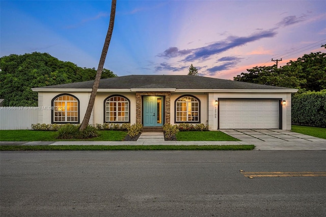 single story home with a garage