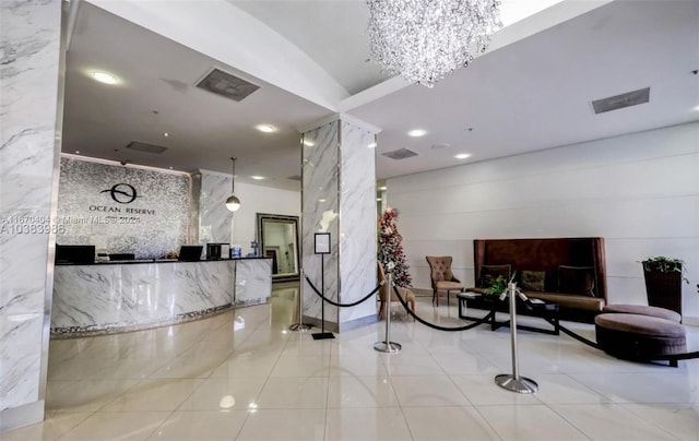 reception area featuring a notable chandelier