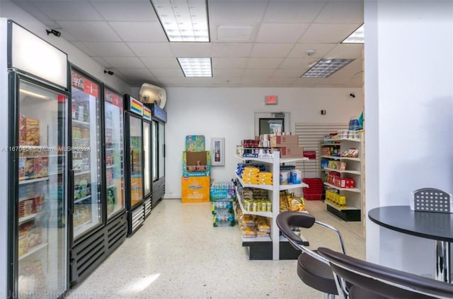 interior space featuring a drop ceiling