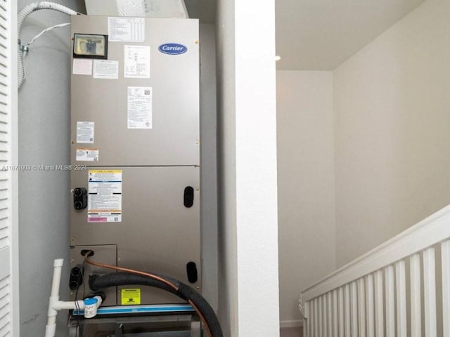 utility room featuring heating unit