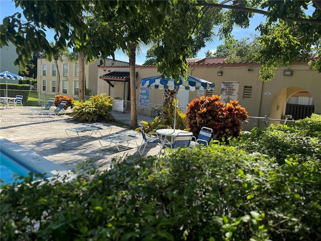 rear view of property with a patio area