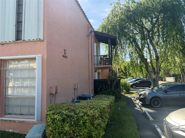 view of side of property featuring a balcony