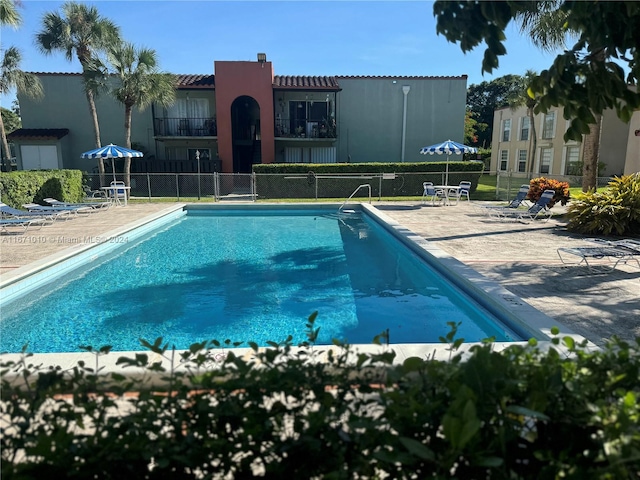 view of pool featuring a patio area