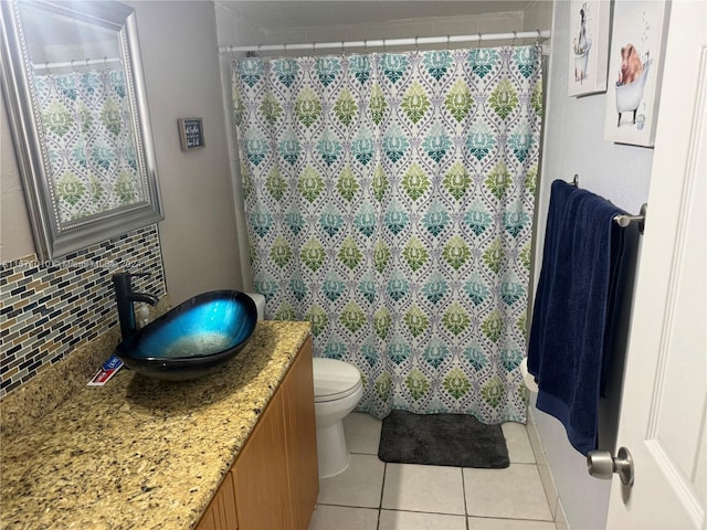 bathroom featuring vanity, backsplash, tile patterned floors, toilet, and a shower with shower curtain