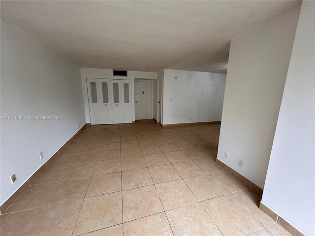 view of tiled spare room