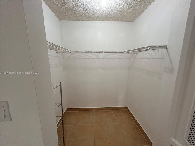 16919 N Bay Rd Unit 204, Sunny Isles Beach, FL 33160 - walk in closet with tile patterned flooring