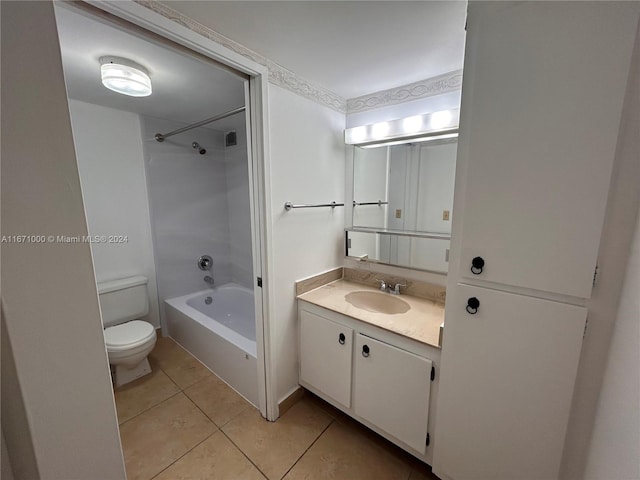 full bathroom featuring toilet, vanity, tile patterned floors, and shower / washtub combination