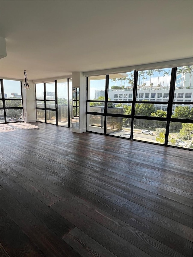 600 NE 36th St Unit 423, Miami, FL 33137 - unfurnished room with healthy amount of natural light and dark wood-style flooring