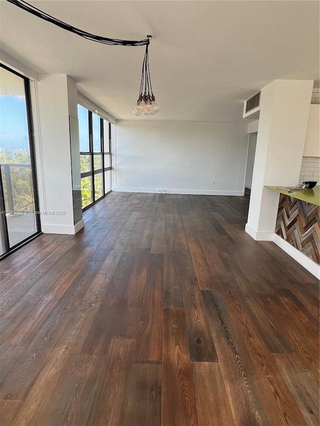 600 NE 36th St Unit 423, Miami, FL 33137 - unfurnished dining area featuring dark wood-type flooring, baseboards, and a wall of windows