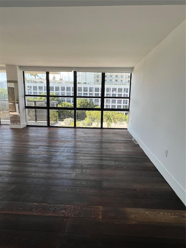 600 NE 36th St Unit 423, Miami, FL 33137 - spare room with dark wood-style flooring and baseboards