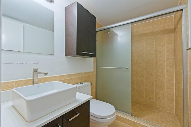 600 NE 36th St Unit 423, Miami, FL 33137 - bathroom with toilet, a shower stall, vanity, and tile walls