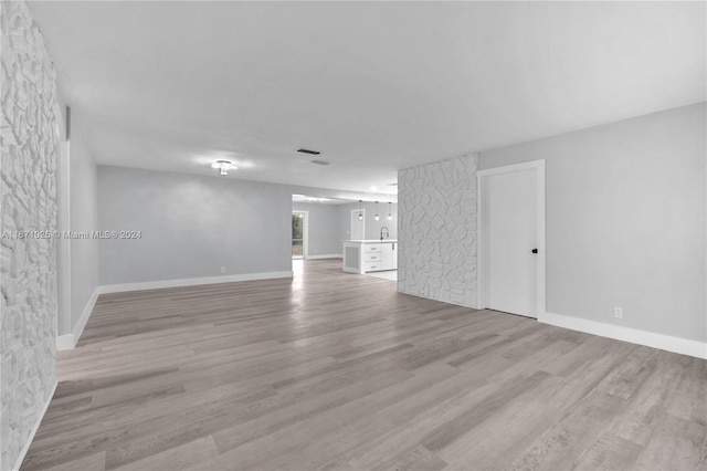 unfurnished room with light hardwood / wood-style floors